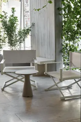 a bench and a picnic table and a table at Alinea Primo Historic Center in Limassol
