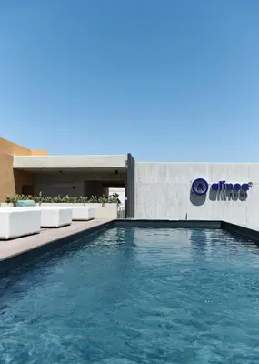 a swimming pool in front of a building at Alinea Primo Historic Center in Limassol