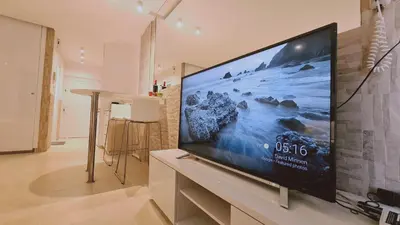 a large flat screen tv in a living room at STAY Lavish Studio in Ayia Napa