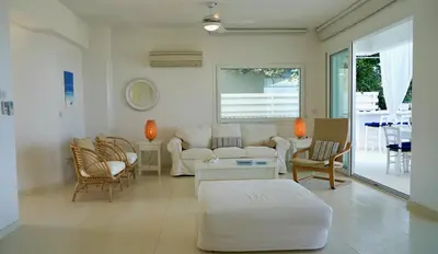 a living room with a couch and chairs at Narcissus 18 in Paralimni