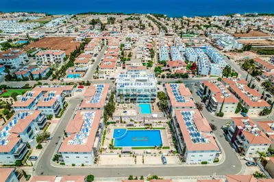 an aerial view of a resort with a pool at SunnyVillas: 2BR Mythical Apt*Swimming Pool*AK04 in Paralimni