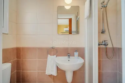 a bathroom with a sink and a shower at Villa Sunrise Pernera in Paralimni