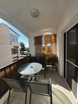 a patio with a table and chairs on a balcony at Theodoros Apt.79 in Paralimni