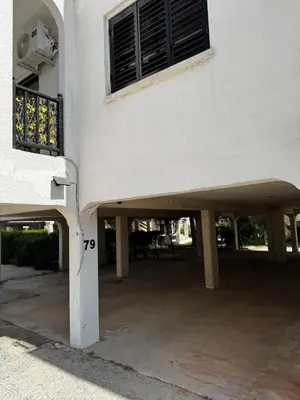 a building with an open patio with a balcony at Theodoros Apt.79 in Paralimni