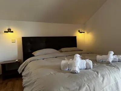 a bedroom with a large bed with towels on it at Maestro Sea - View Apartment in Larnaka