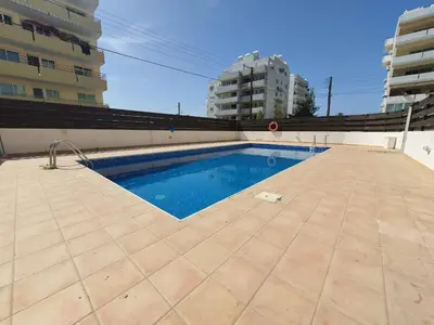 a swimming pool on the roof of a building at Andrea 3-Bedroom Apt in Mackenzie in Larnaka