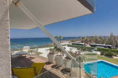 a balcony with a view of the ocean at Thalassa Luxury Apartment in Protaras
