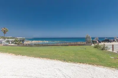 a park with the ocean in the background at Thalassa Luxury Apartment in Protaras