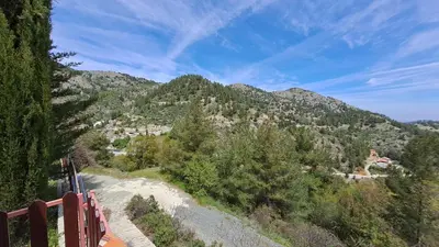 a view of a mountain with trees and a road at Mountain View 2BR House with Garden & Free Parking Ioannis Ylation Saranti in Nicosia